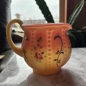 Fenton Burmese Glass Pitcher Hand Painted rose motifs. Glows under UV light Vint